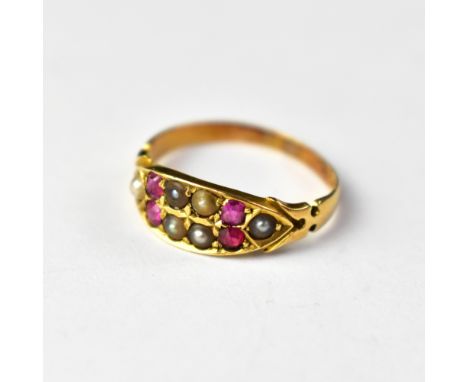 A Victorian 18ct gold ring set with four small rubies and seed pearls, on flower head shoulders, size N, approx 2.4g.