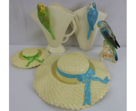 Five items of collectible pottery comprising two Falcon ware pottery Summer Hats, diameters 26cm and 16cm, a china figure of 