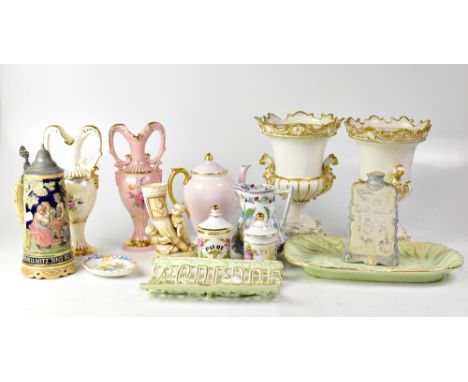 A large collection of decorative ceramics including a pair of porcelain figures, tea cups and saucers, a large pair of vases 