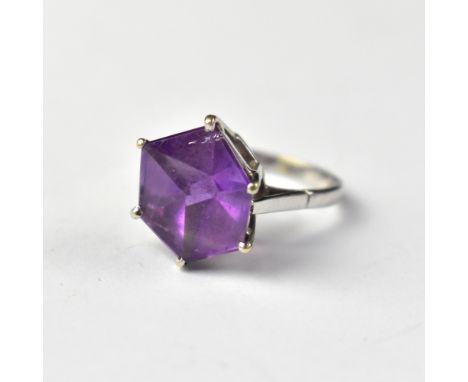 A 9ct white gold amethyst ring, the claw set amethyst cut as a 3D cube form, in a cathedral mount, size N, approx 5g.