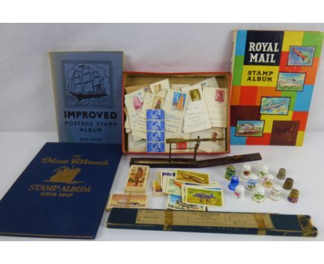 Various collectibles to include a pair of sovereign scales by H Bell (af), three hobbyist stamp albums, a selection of cigare