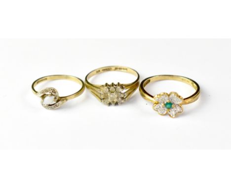 Three 9ct gold dress rings comprising a modern example with flower-shaped top and central green stone, with tiny stone chips 