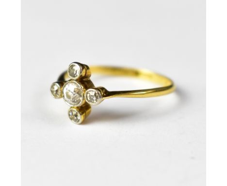 A small 18ct gold Art Deco five-stone diamond ring, the central bezel set brilliant cut diamond approx 0.25ct, with a smaller