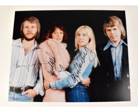 ABBA; colour promotional photograph bearing signatures of all four members of the band.We have not authenticated these signat