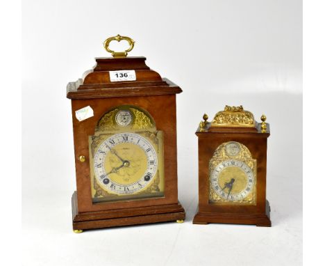 A walnut bracket-style clock, the brass face with silvered chapter ring set with Roman numerals, stamped 'Asprey, an Elliott 