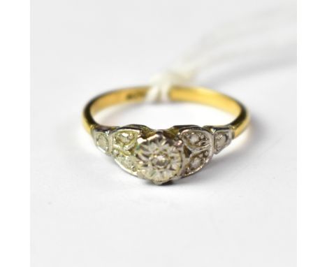 An 18ct gold ring with an illusion set diamond in a platinum head, size N, approx 2.6g.