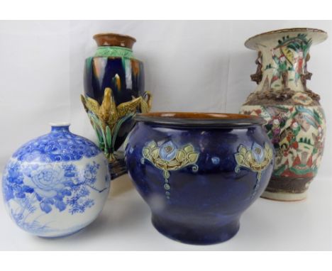 A 19th century Doulton Lambeth jardinière with Art Nouveau flower groups on a blue ground, height 18cm, diameter approx 24cm,