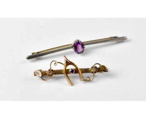 Two bar brooches comprising a white metal example with central oval amethyst stone, length 6cm, and a Victorian yellow metal 