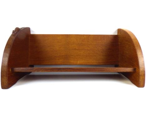 WORKSHOP OF ROBERT 'MOUSEMAN' THOMPSON; a vintage oak book trough with quarter curved sides, plank back and bottom, with carv