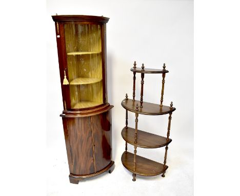 A reproduction mahogany bow-fronted freestanding glazed corner cupboard, with single bowed glazed door enclosing two shelves,