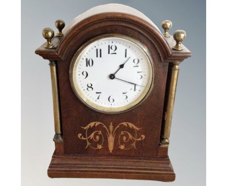 A late Victorian inlaid mahogany mantel clock 