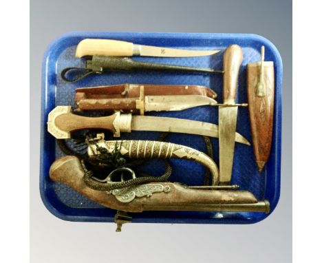 A tray of replica black powder pistol, vintage and later knives, Indian knife in scabbard, Persian knife in scabbard, Bowie k