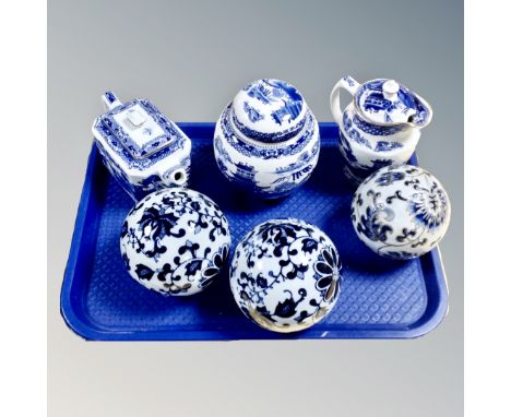 A tray of Ringtons Willow pattern caddy, teapot and jug, three further ceramic blue and white balls 