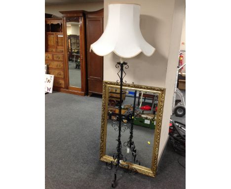 A gilt framed over mantel mirror together with wrought iron standard lamp with shade 