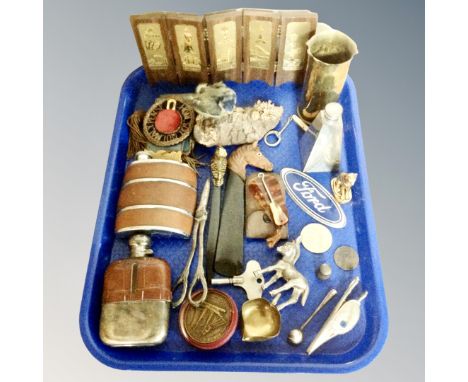 A tray of taxidermy blue tit, hip flask, shoe horn, letter opener, medals, Ford car badge, brass trench vase etc 