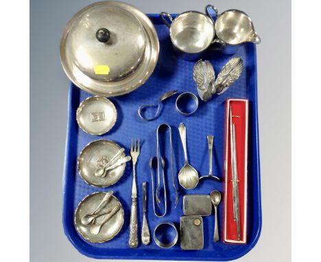 A tray of assorted plated wares, muffin dish with cover, coin dishes, sugar tongs, silver-handled pickle fork etc 