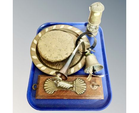 A tray of assorted metal wares, brass dinner gong with wall bracket, butler's bell, Lamp and Limelight miner's lamp, brass an