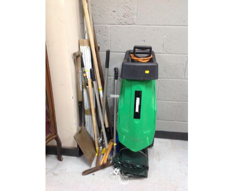 An electric garden shredder together with a quantity of tools 