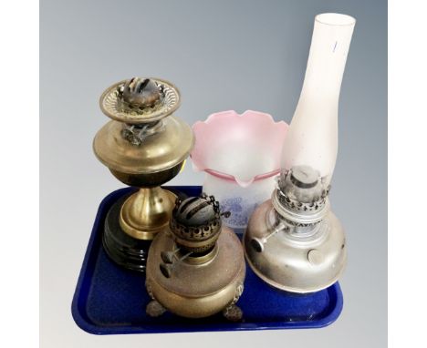 A tray of 19th century brass oil lamp, two further lamps one with chimney and two-tone glass shade 