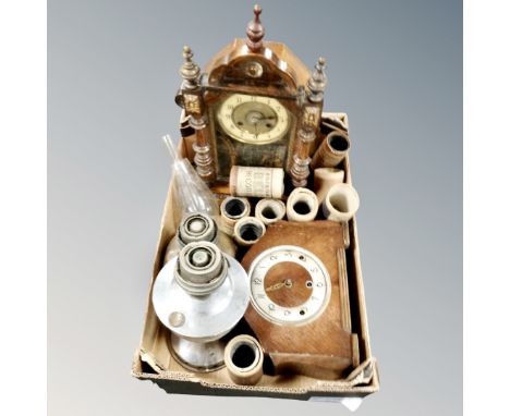 A box of two oil lamp bases, Art Deco oak mantel clock, further Victorian mantel clock