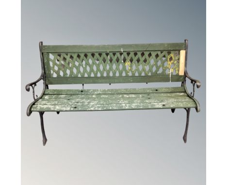 A wooden and metal ended garden bench 