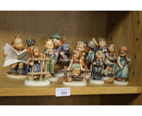 A COLLECTION OF HUMMEL FIGURES