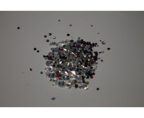 A BAG OF LOOSE MIXED STONES INCLUDING CUBIC ZIRCONIA, RUBY, EMERALD, SAPPHIRE, AMETHYST AND PERIDOT 89.5 CT