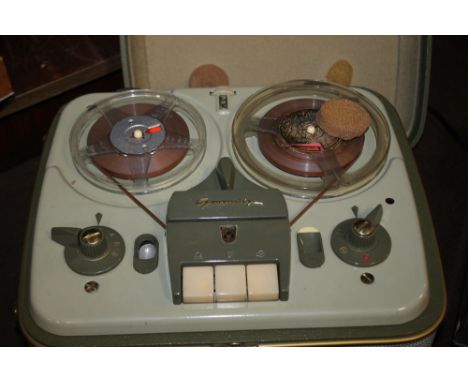A GRUNDIG REEL TO REEL TAPE RECORDER WITH INSTRUCTION BOOK