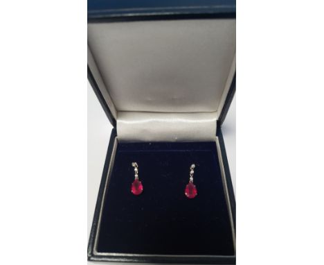 A PAIR OF 18 CT WHITE GOLD RUBY AND DIAMOND DROP EARRINGS WITH BUTTERFLY BACKS, RUBIES ARE 2.00 CT, DIAMONDS 0.08 CT, BOXED