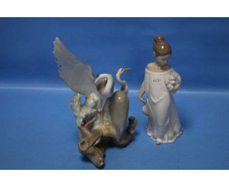 A NAO FIGURINE AND A HERON GROUP