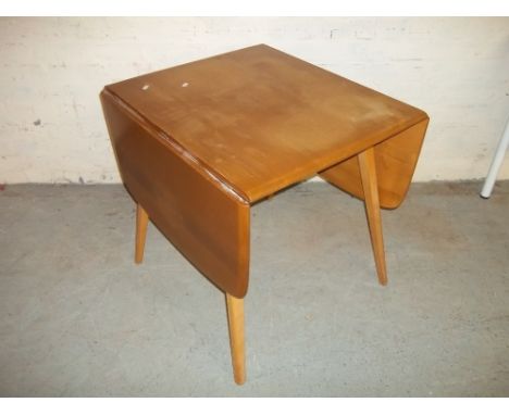 AN ERCOL DROP LEAF DINING TABLE