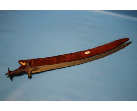 AN INDIAN TLWAR SWORDCondition Report:  The blade inserts full into the scabbard, the blade is approx. 55.5 cm, the scabbard 