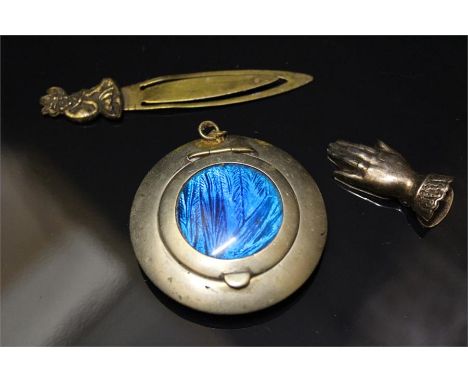 A Silver Plated Compact with butterfly wing encased, a Silver Plated Hand Placement setting or bookmark and a brass bookmark.