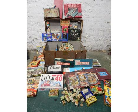 Vintage wooden bound trunk full of vintage toys and board games, cleudo, operation, etc