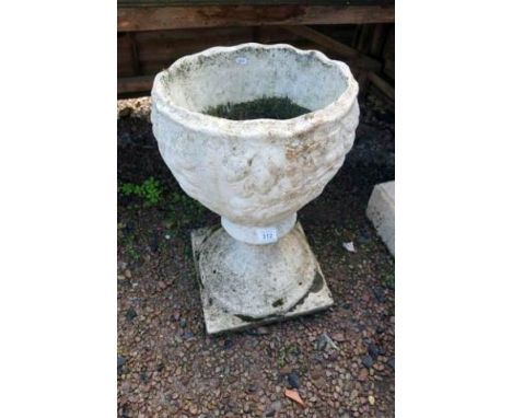 Stone planter on plinth