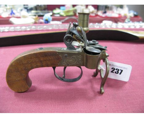 A Flintlock Pistol Butt and Lock, in the form a a candlestick.