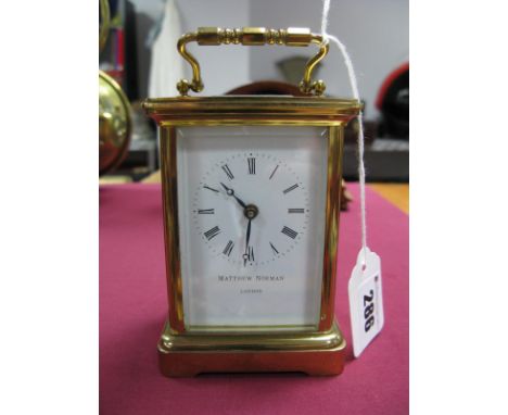 A Matthew Norman Brass Cased Carriage Clock, bevelled glass, with carrying handle (rear door not attached), 11cm high