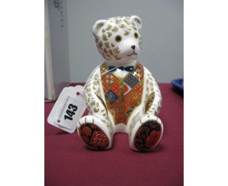 A Royal Crown Derby Paperweight, modelled as 'Teddy Bear', wearing a blue/green bow tie, date code for 1998, gold stopper.