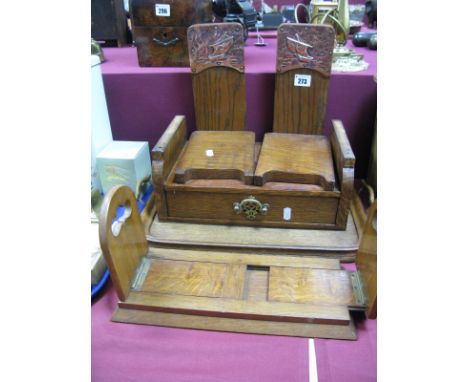 An Edwardian Oak Tray, a Bateman sliding book trough, oak bookends with embossed copper 'ship' panels, oak drawer with later 