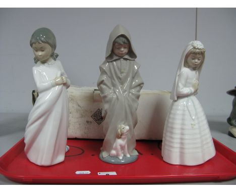 Three Nao Figures; Girl Sleeping (boxed), Boy in Raincoat with Dog and Communion Girl. (3)