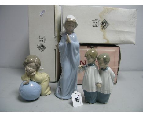 Three Nao Figures; 'Girl Praying', No. 298, 'Choir Boys', No. 1072 and 'A World of Dreams', No. 1357 (all boxed). (3)