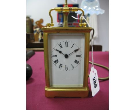 A XX Century French Carriage Clock, with white enamel dial, Roman numerals.