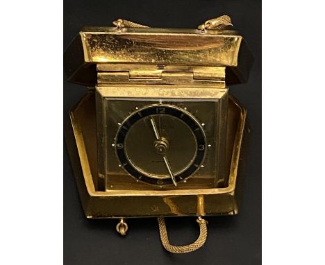 A vintage Europa travelling alarm clock in the form of a handbag 