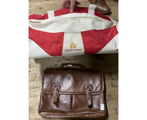 A vintage leather attaché case and a Queen Mary II holdall 