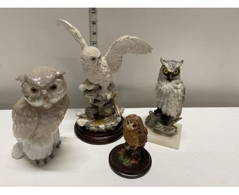 A selection of owl figurines including NAO 