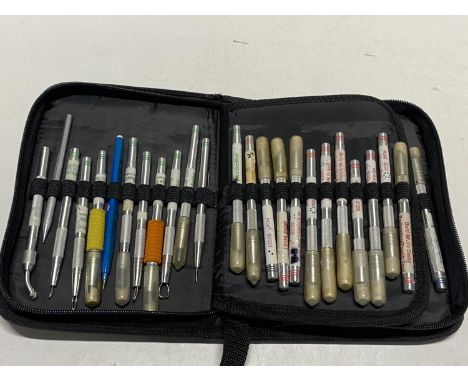 A cased selection of crafting tools including scalpels, punches etc
