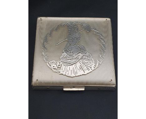 A vintage Rex Art Deco period ladies compact with silver decoration to top 
