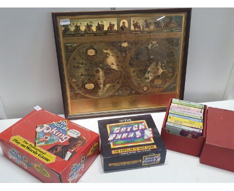 A selection of vintage board games and books with a Blaeu framed print, shipping unavailable