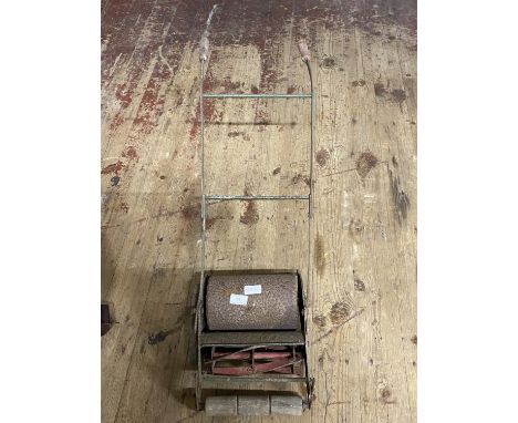 A vintage child's push along lawn mower, shipping unavailable