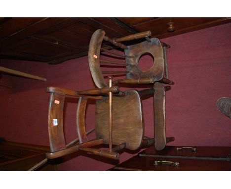 An early 20th century child's elm seat and beech bar back high chair, together with a further child's stickback commode chair